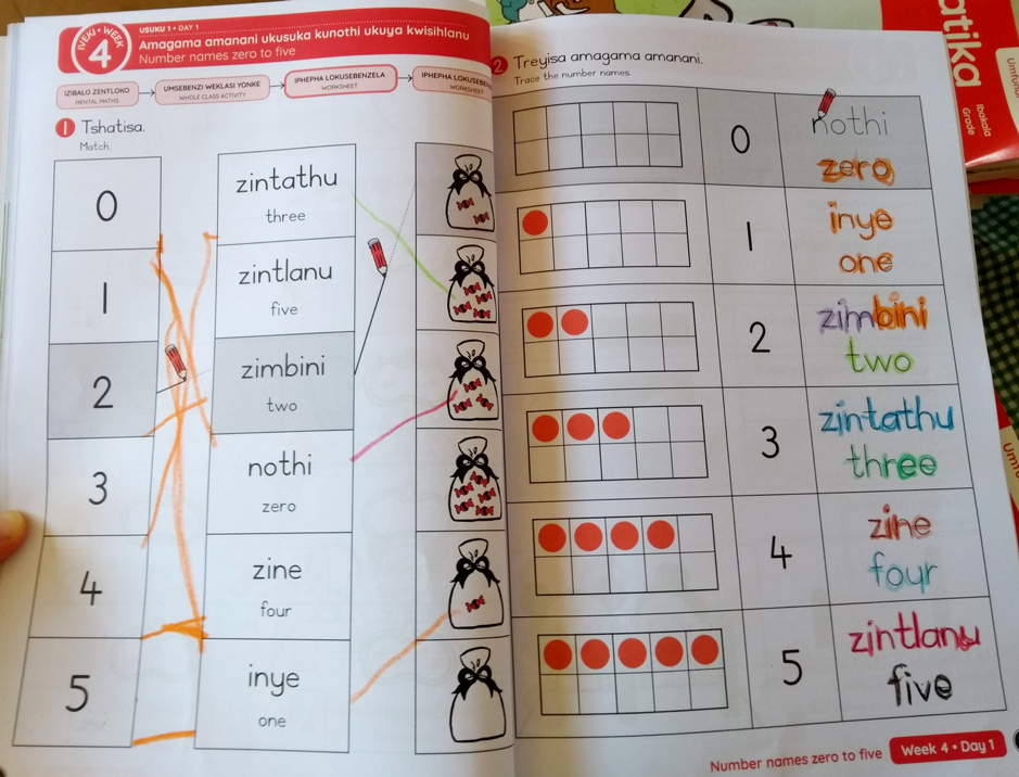 Two pages of an exercise book with mathematics problems using words and numbers