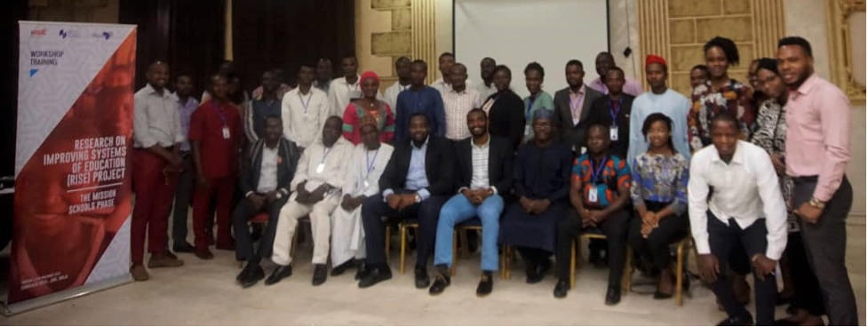 Image of group of enumerators at a training session in 2019 ahead of data collection